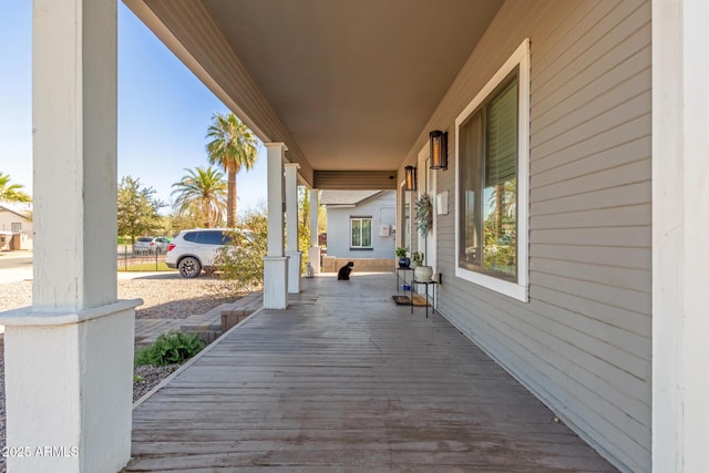 wooden terrace featuring a porch