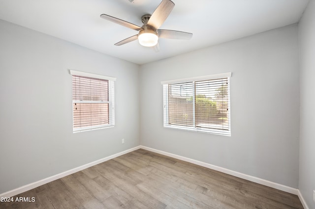 unfurnished room with ceiling fan and light hardwood / wood-style floors