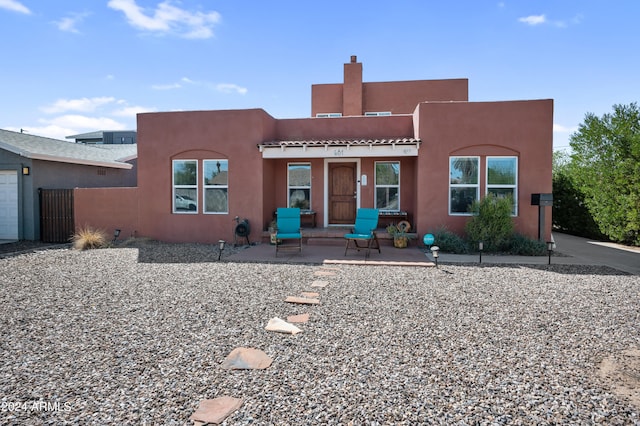 back of house with a patio area