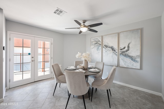 dining room featuring ceiling fan and french doors