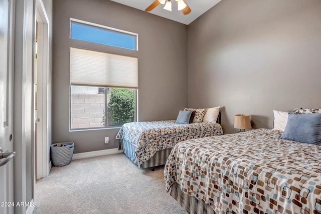 bedroom with ceiling fan and carpet floors