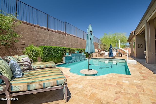 view of pool featuring an outdoor living space, a patio area, a fenced backyard, and a fenced in pool