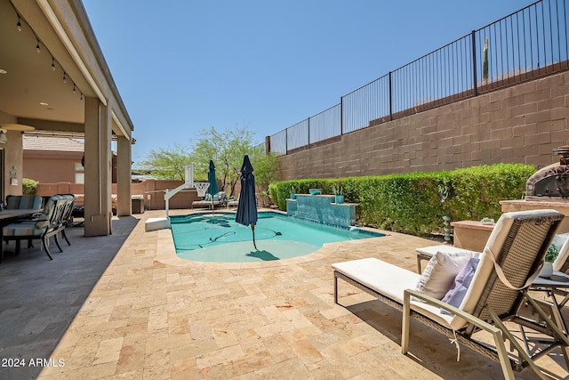 view of swimming pool with a patio area, a fenced backyard, and a fenced in pool