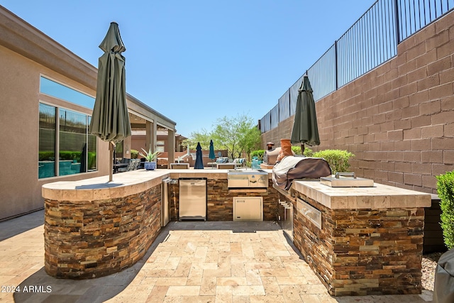 view of patio / terrace featuring fence and area for grilling