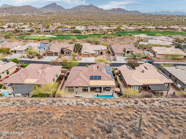 drone / aerial view featuring a residential view and a mountain view