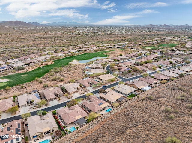 birds eye view of property with view of golf course, a residential view, and a mountain view