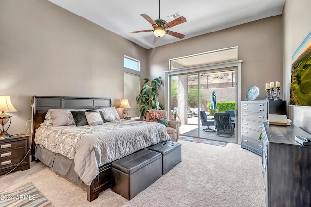 bedroom with access to outside, visible vents, ceiling fan, and light colored carpet