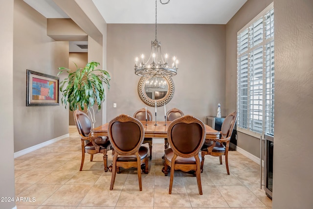 dining space with an inviting chandelier and light tile patterned flooring