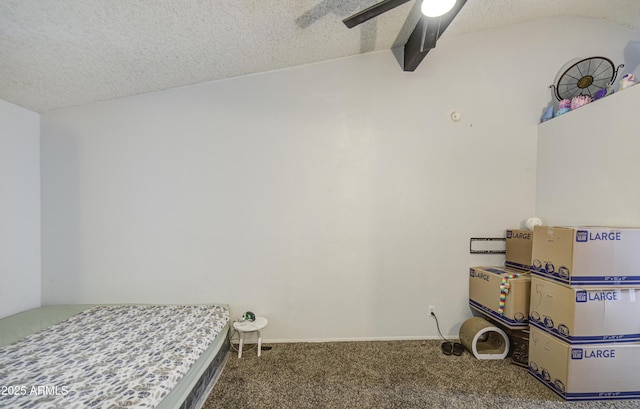 2301 E University Dr Unit 488, Mesa, AZ 85213 - bedroom featuring carpet floors, a textured ceiling, vaulted ceiling, and ceiling fan