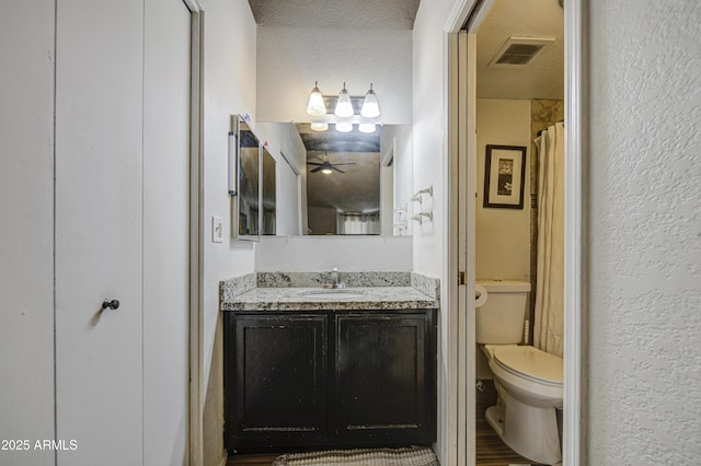 2301 E University Dr Unit 488, Mesa, AZ 85213 - full bath with toilet, vanity, and a textured wall
