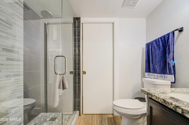 2301 E University Dr Unit 488, Mesa, AZ 85213 - full bath with toilet, a stall shower, vanity, and wood finished floors