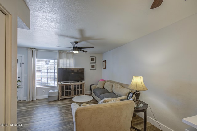 2301 E University Dr Unit 488, Mesa, AZ 85213 - living room with ceiling fan, baseboards, wood finished floors, and a textured ceiling