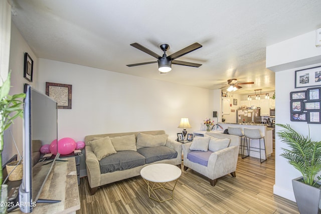 2301 E University Dr Unit 488, Mesa, AZ 85213 - living room with a ceiling fan and light wood-type flooring