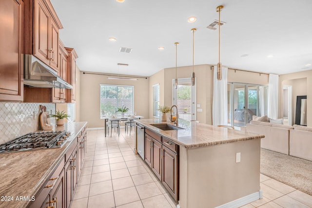 kitchen featuring visible vents, stainless steel appliances, under cabinet range hood, and a sink