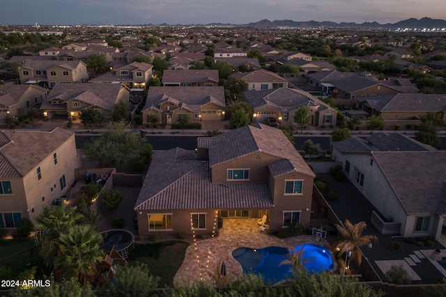 aerial view at dusk with a residential view