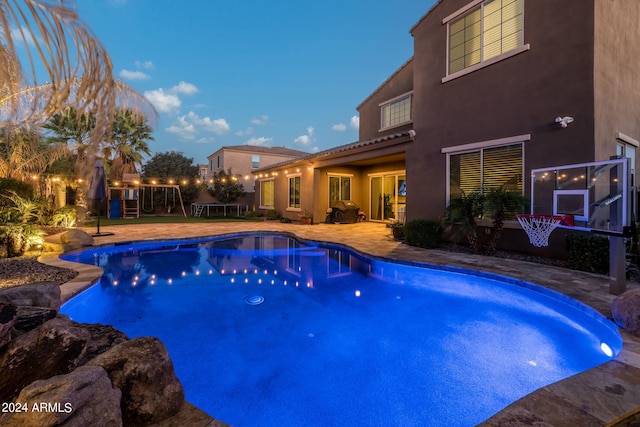 view of swimming pool with a patio