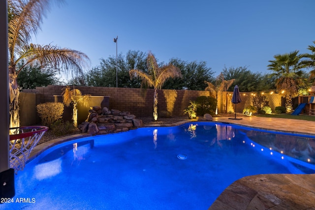 view of swimming pool featuring a fenced in pool and a fenced backyard