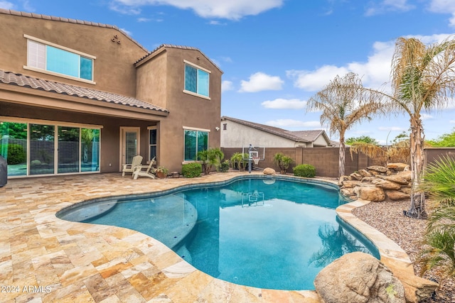 view of swimming pool with a patio area, a fenced in pool, and a fenced backyard