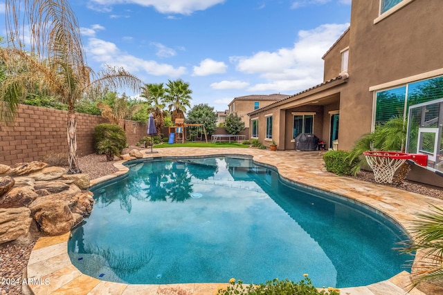 view of swimming pool with a fenced in pool, a patio, and a fenced backyard