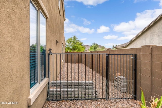 view of gate featuring fence