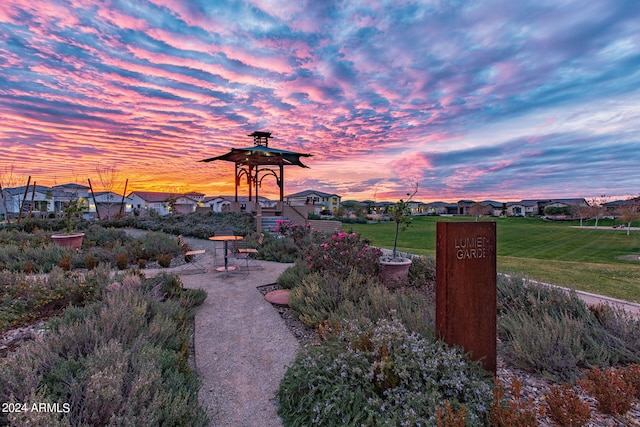 view of property's community with a lawn