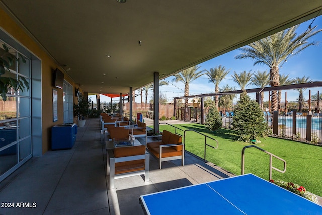 view of patio featuring an outdoor hangout area and fence