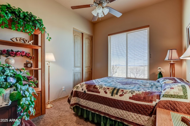 bedroom featuring baseboards, a closet, ceiling fan, and carpet flooring