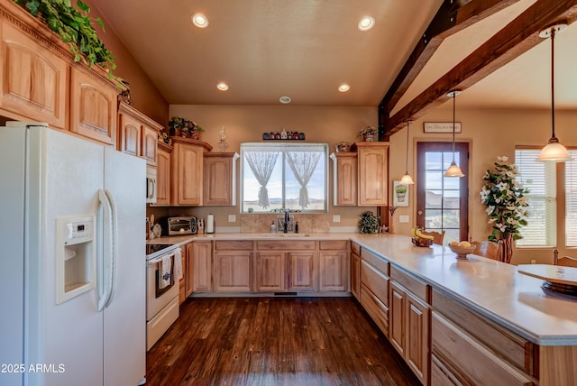 kitchen with light countertops, a peninsula, light brown cabinets, and white appliances