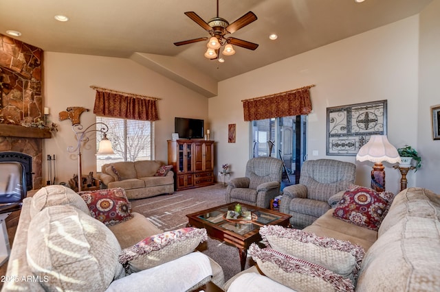 living room featuring vaulted ceiling, ceiling fan, recessed lighting, and a fireplace