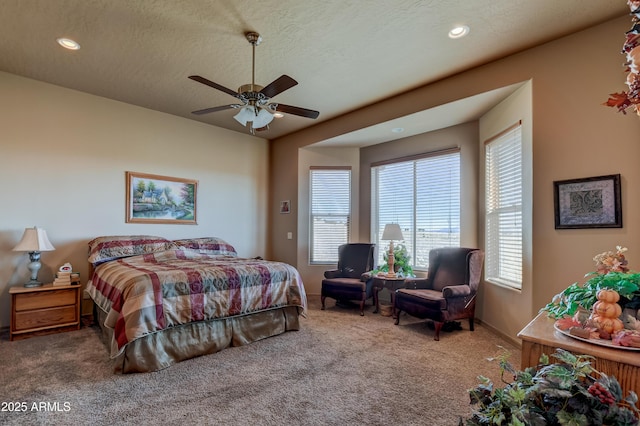 carpeted bedroom featuring ceiling fan, recessed lighting, and a textured ceiling