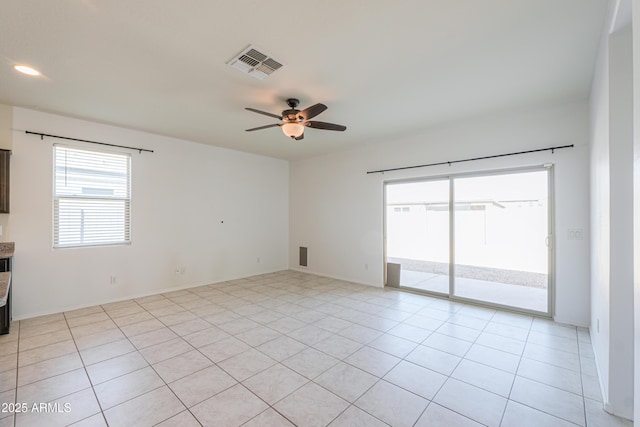 empty room featuring recessed lighting, light tile patterned flooring, visible vents, and a ceiling fan