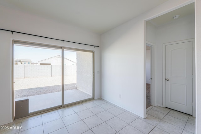 empty room with light tile patterned floors