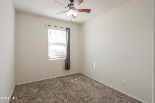 unfurnished room with ceiling fan, carpet floors, and baseboards