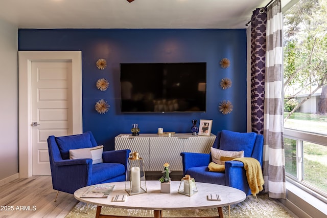 living area with hardwood / wood-style flooring