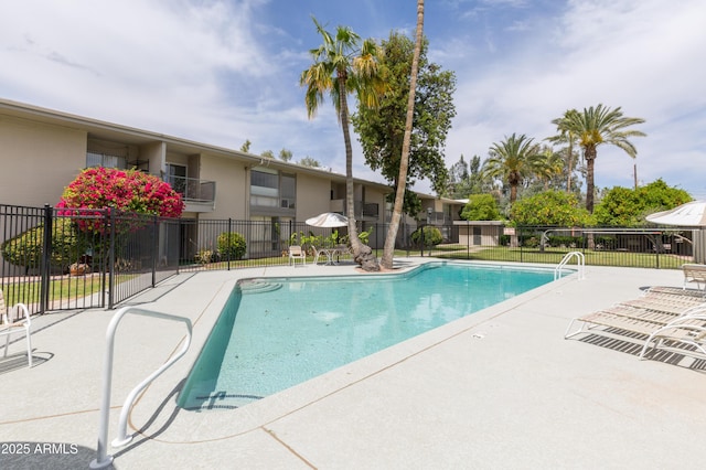 view of swimming pool featuring a patio area