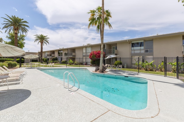 view of swimming pool with a patio area