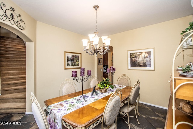 dining space with a notable chandelier