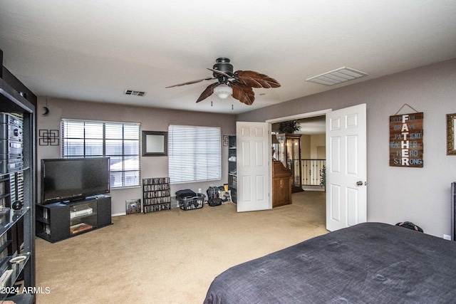 carpeted bedroom with ceiling fan