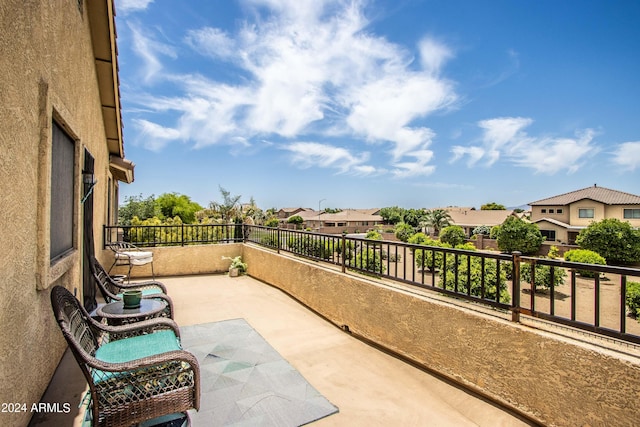 view of patio featuring a balcony