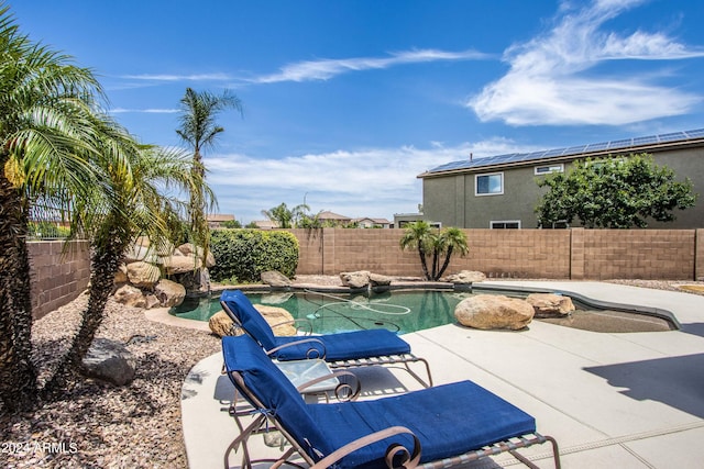 view of swimming pool featuring a patio area