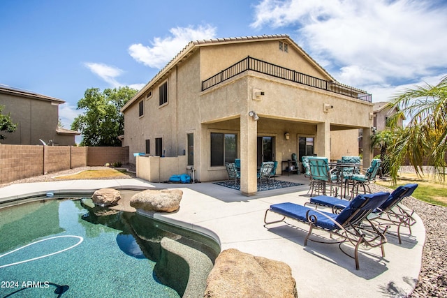 view of swimming pool with a patio area