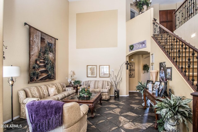 living room with a high ceiling