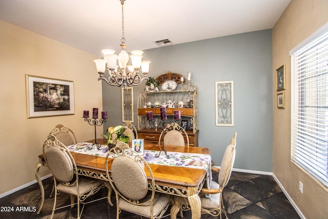 dining area with a notable chandelier