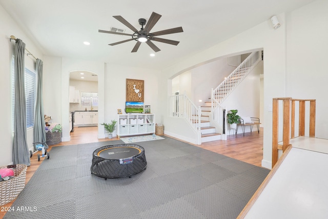 interior space with light wood-type flooring and ceiling fan