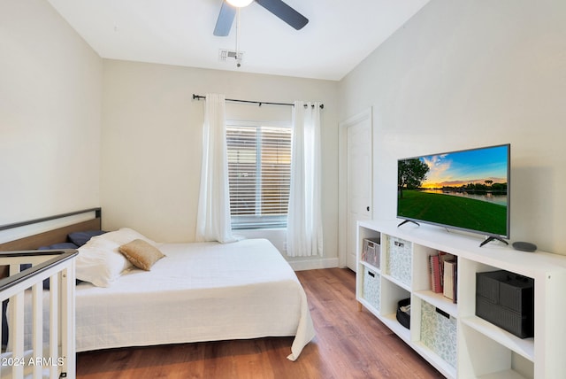 bedroom featuring ceiling fan and wood-type flooring