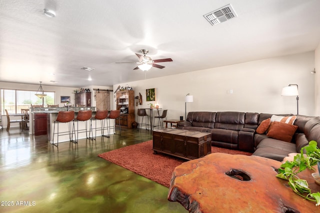 4621 S 179th Dr, Goodyear, AZ 85338 - living area with finished concrete flooring and ceiling fan