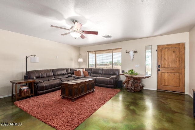 4621 S 179th Dr, Goodyear, AZ 85338 - living room with concrete flooring and a ceiling fan