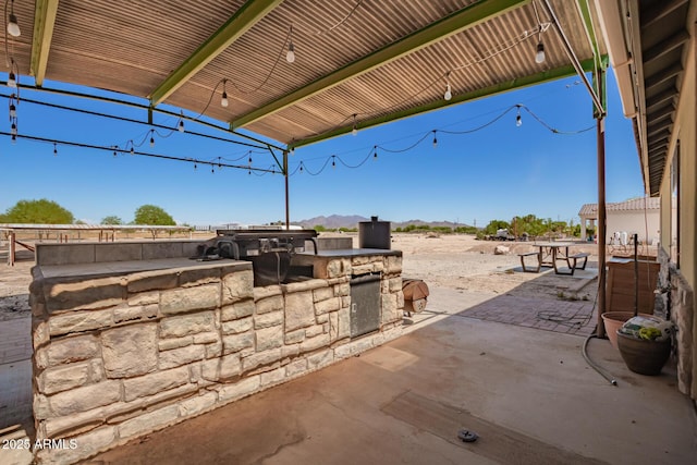 4621 S 179th Dr, Goodyear, AZ 85338 - view of patio featuring an outdoor kitchen and a mountain view
