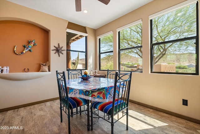 dining room featuring ceiling fan and light hardwood / wood-style floors