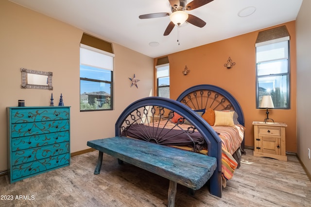 bedroom featuring hardwood / wood-style flooring and ceiling fan